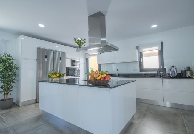 Villa with pool for 12 people in Son Serra, Mallorca. 6 DBR, 7 BR, AC, fitness pool, roof terrace with heated whirlpool, music/light-system, bikes.