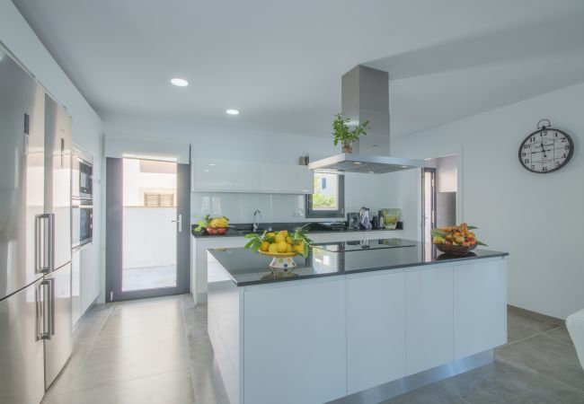 Villa with pool for 12 people in Son Serra, Mallorca. 6 DBR, 7 BR, AC, fitness pool, roof terrace with heated whirlpool, music/light-system, bikes.