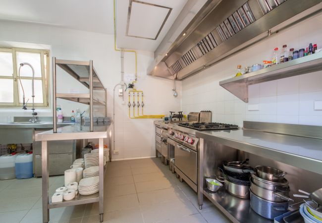 Rural house with pool for 16 people in Alcúdia, Mallorca. 8 DBR, 8 BR en suite, 1 outdoor bath, 2 guest WCs, XXL pool, several terraces, garden & in-house bodega.