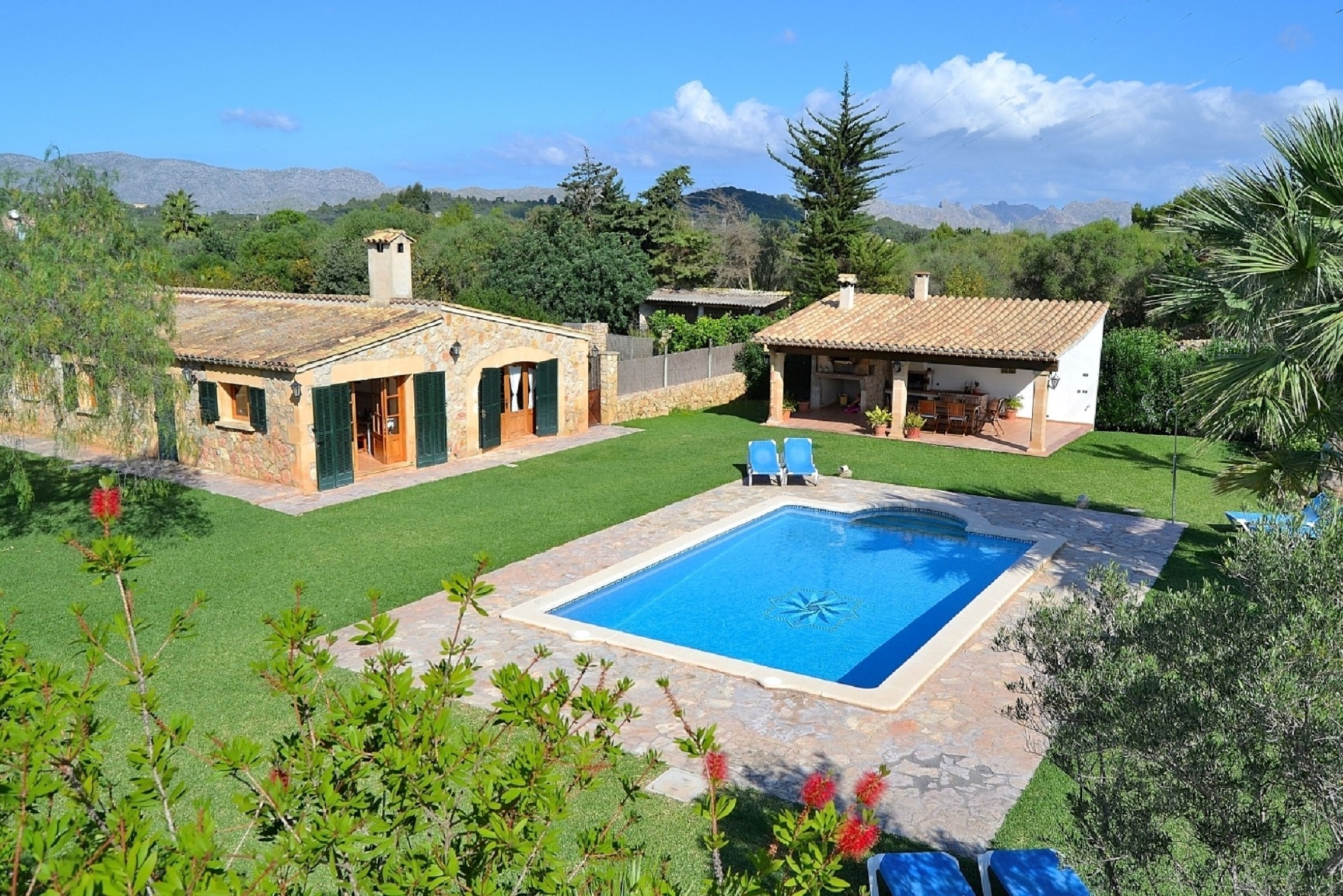 Aerial view of Finca Can Roig and its large pool in Mallorca
