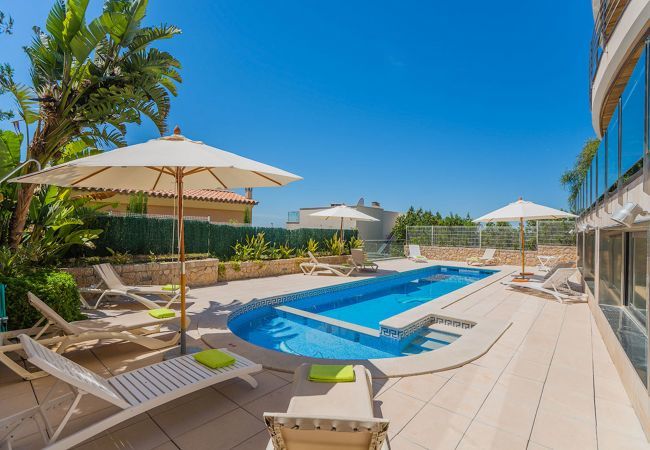 Villa with pool for 10 persons in Alcanada, Mallorca. 5 DBR, 5 BR en suite, AC, free wifi, pool, SPA area with heated indoor pool and whirlpool, fitness and many extras