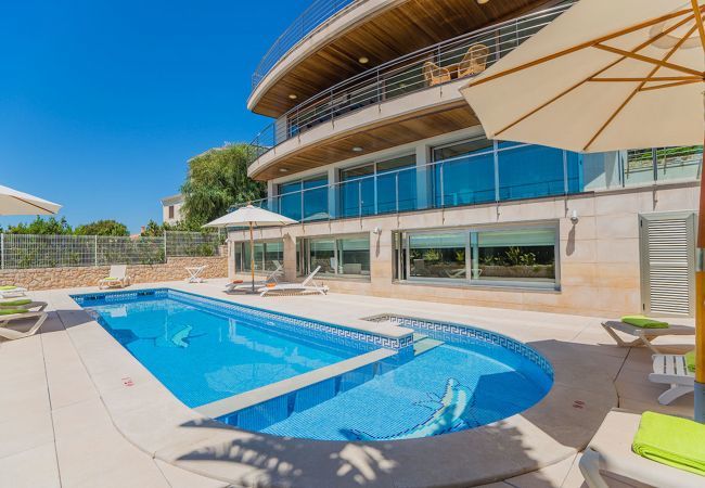 Villa with pool for 10 persons in Alcanada, Mallorca. 5 DBR, 5 BR en suite, AC, free wifi, pool, SPA area with heated indoor pool and whirlpool, fitness and many extras