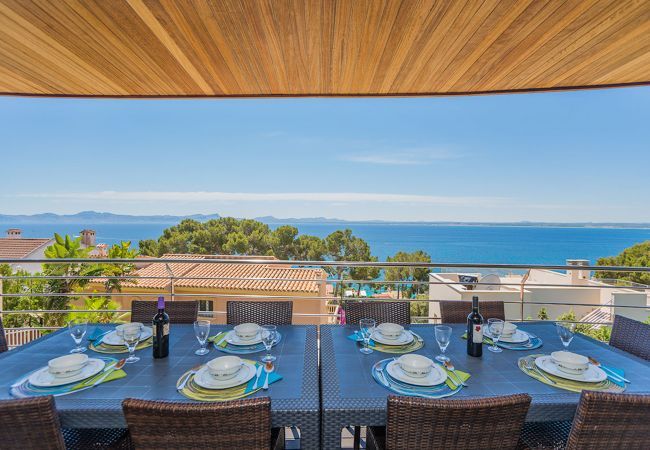 Villa with pool for 10 persons in Alcanada, Mallorca. 5 DBR, 5 BR en suite, AC, free wifi, pool, SPA area with heated indoor pool and whirlpool, fitness and many extras