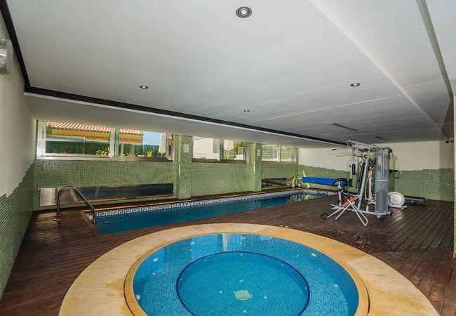 Villa with pool for 10 persons in Alcanada, Mallorca. 5 DBR, 5 BR en suite, AC, free wifi, pool, SPA area with heated indoor pool and whirlpool, fitness and many extras