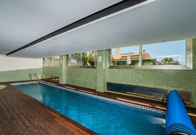 Villa with pool for 10 persons in Alcanada, Mallorca. 5 DBR, 5 BR en suite, AC, free wifi, pool, SPA area with heated indoor pool and whirlpool, fitness and many extras