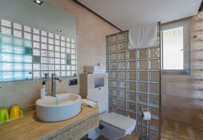 Villa with pool for 10 persons in Alcanada, Mallorca. 5 DBR, 5 BR en suite, AC, free wifi, pool, SPA area with heated indoor pool and whirlpool, fitness and many extras