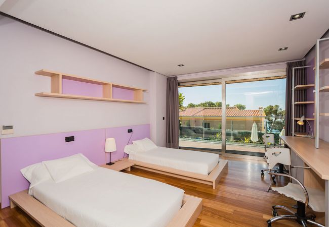 Villa with pool for 10 persons in Alcanada, Mallorca. 5 DBR, 5 BR en suite, AC, free wifi, pool, SPA area with heated indoor pool and whirlpool, fitness and many extras