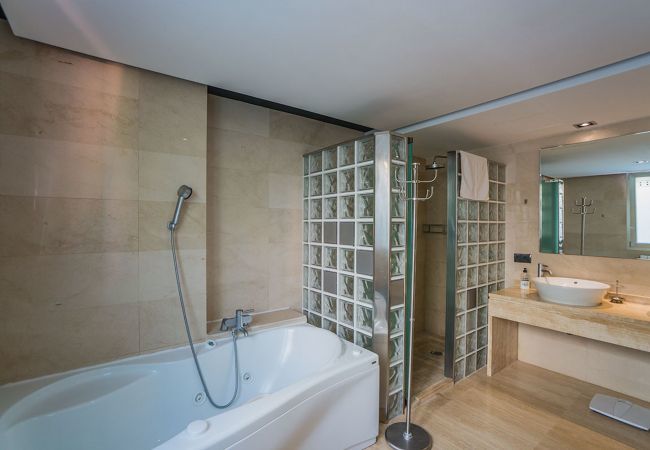 Villa with pool for 10 persons in Alcanada, Mallorca. 5 DBR, 5 BR en suite, AC, free wifi, pool, SPA area with heated indoor pool and whirlpool, fitness and many extras