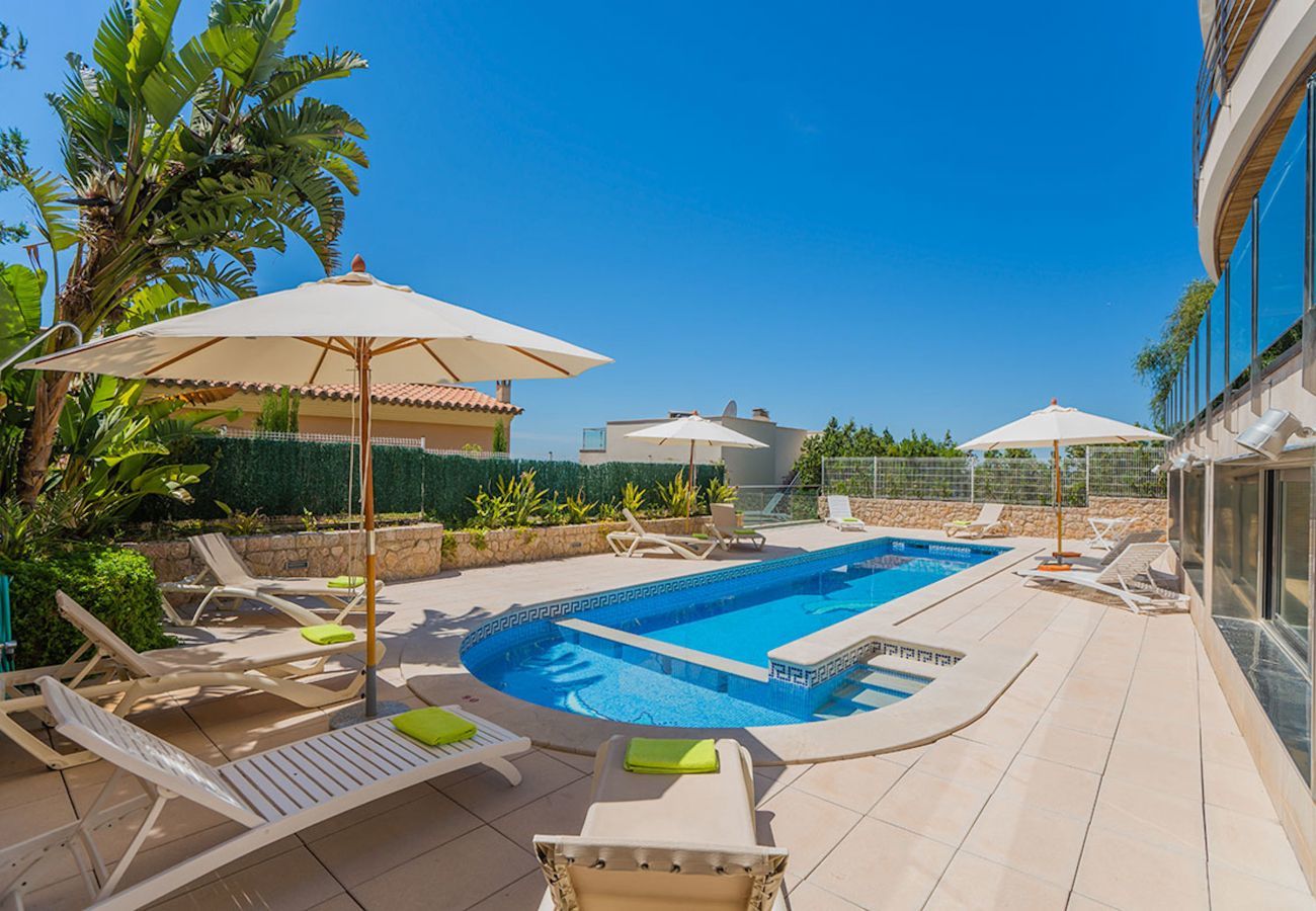 Villa with pool for 10 persons in Alcanada, Mallorca. 5 DBR, 5 BR en suite, AC, free wifi, pool, SPA area with heated indoor pool and whirlpool, fitness and many extras