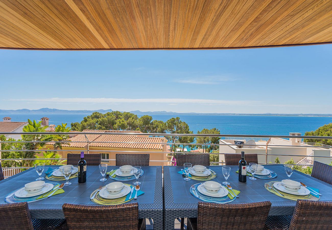 Villa with pool for 10 persons in Alcanada, Mallorca. 5 DBR, 5 BR en suite, AC, free wifi, pool, SPA area with heated indoor pool and whirlpool, fitness and many extras